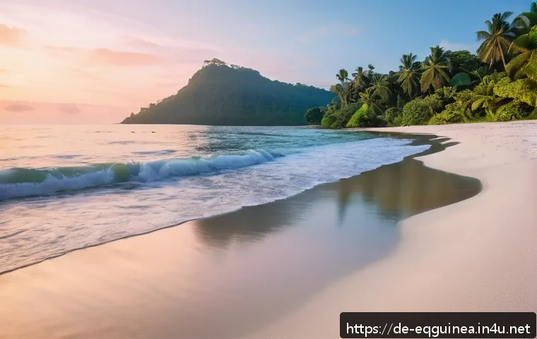 적도 기니에서의 사진 촬영 명소 - A serene, untouched white sand beach on Bioko Island during golden hour, with the sun low on the hor...